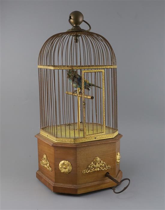 An early 20th century Swiss gilt metal mounted mahogany singing bird in a cage automaton, H.21in.